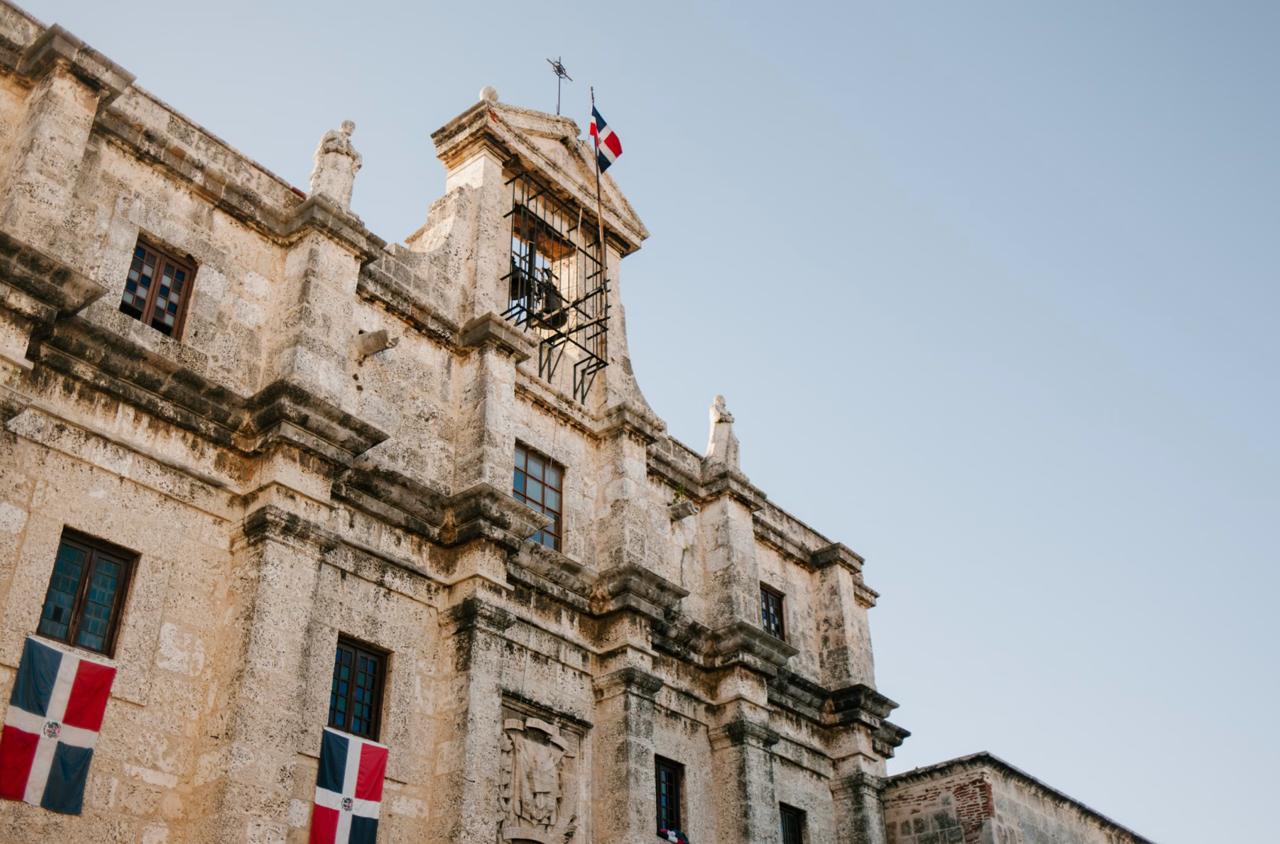 Colonial building draped in Dominican Republic flags