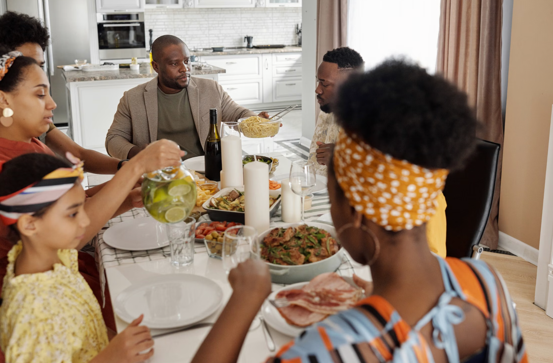 Dominican family gathered together sharing a meal