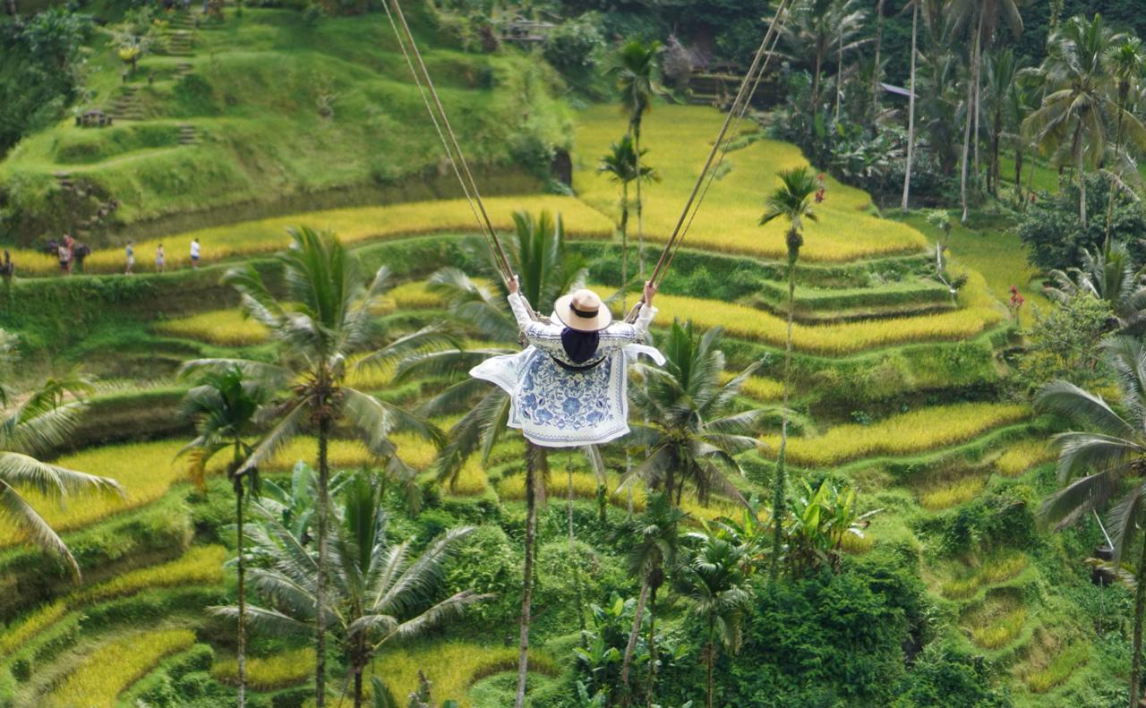 Thrill-seeker experiencing G Swing Bali extreme swing 40 meters high