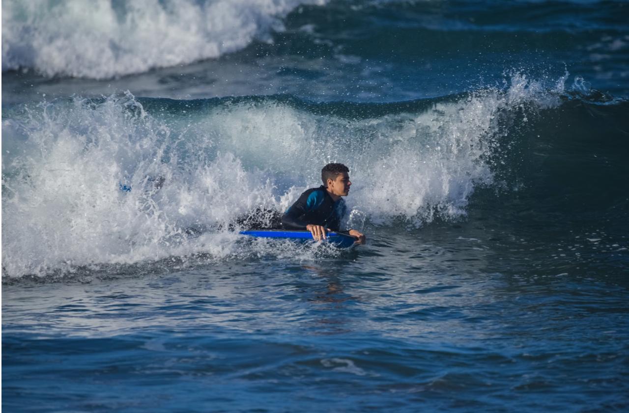 Advanced surfer riding a powerful wave at Echo Beach Canggu Bali