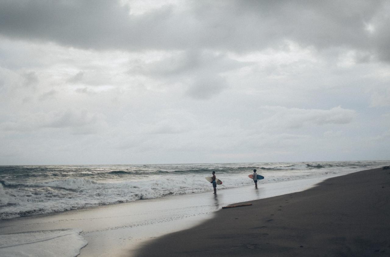 Peaceful Berawa Beach in Canggu with black sand and fewer crowds