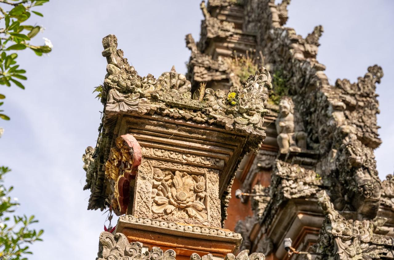 Ancient Hindu temple carved into clifftside overlooking Seram Strait