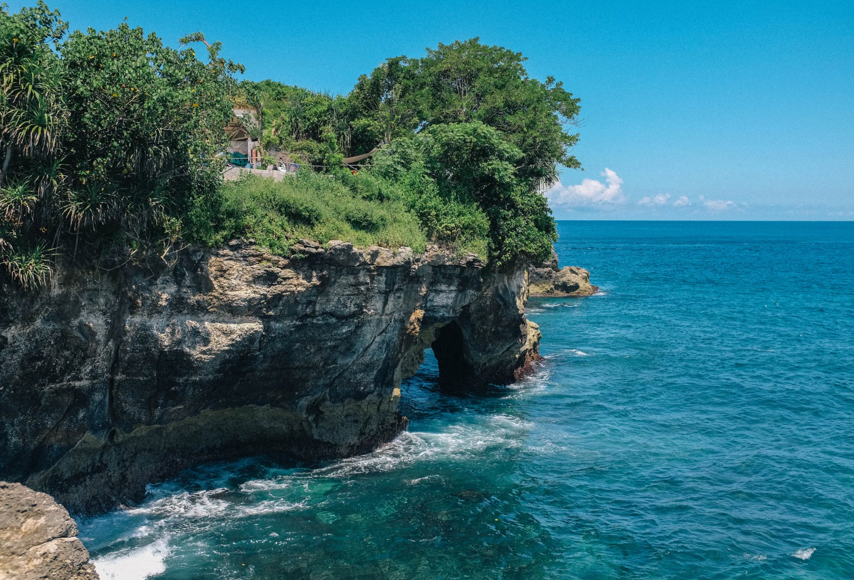 Cliff turquoise ocean water Bali tropical