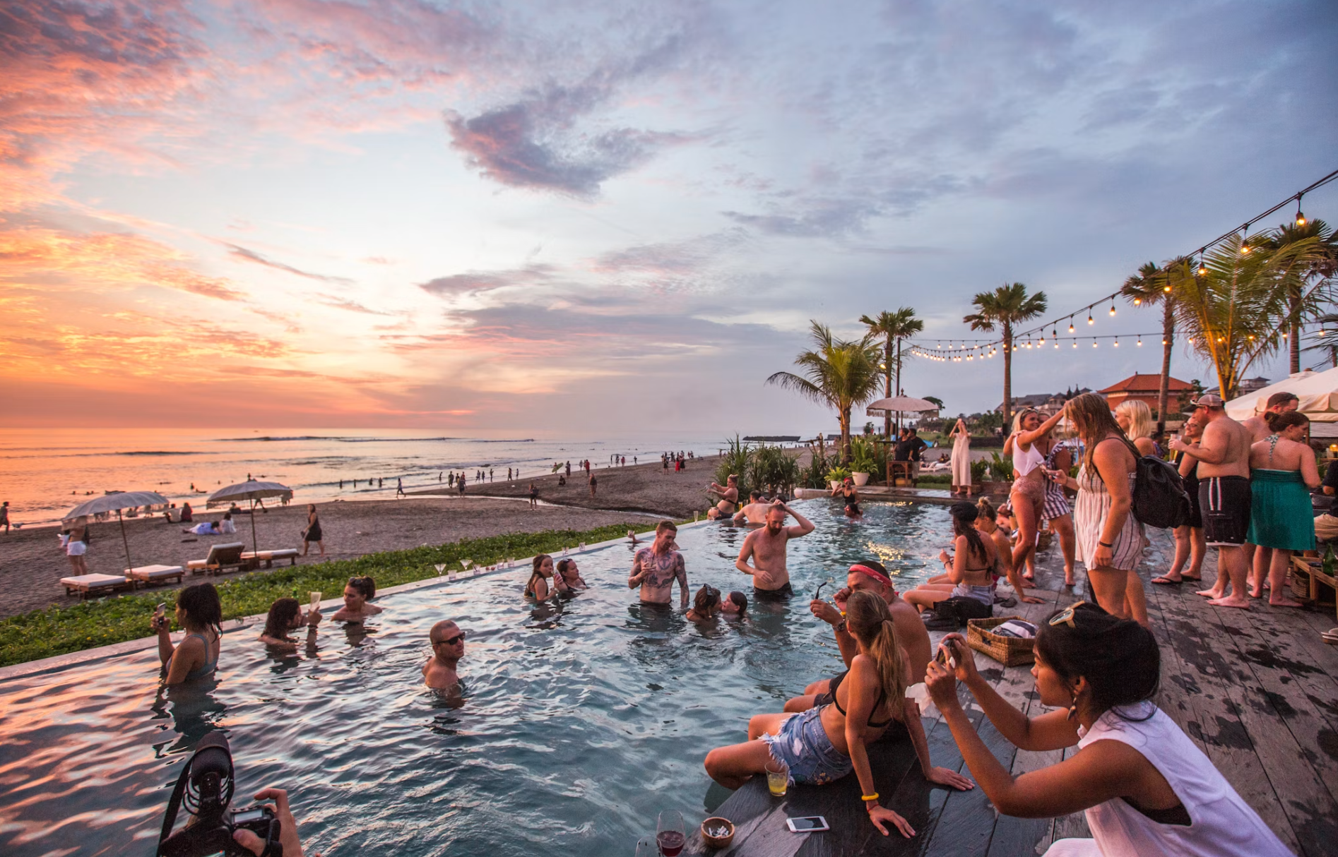 Potato Head Beach Club infinity pool with beachfront loungers and cocktails