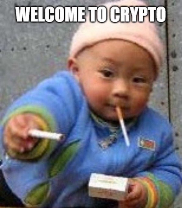 Tough-looking baby holding cigarettes captioned welcome to crypto.