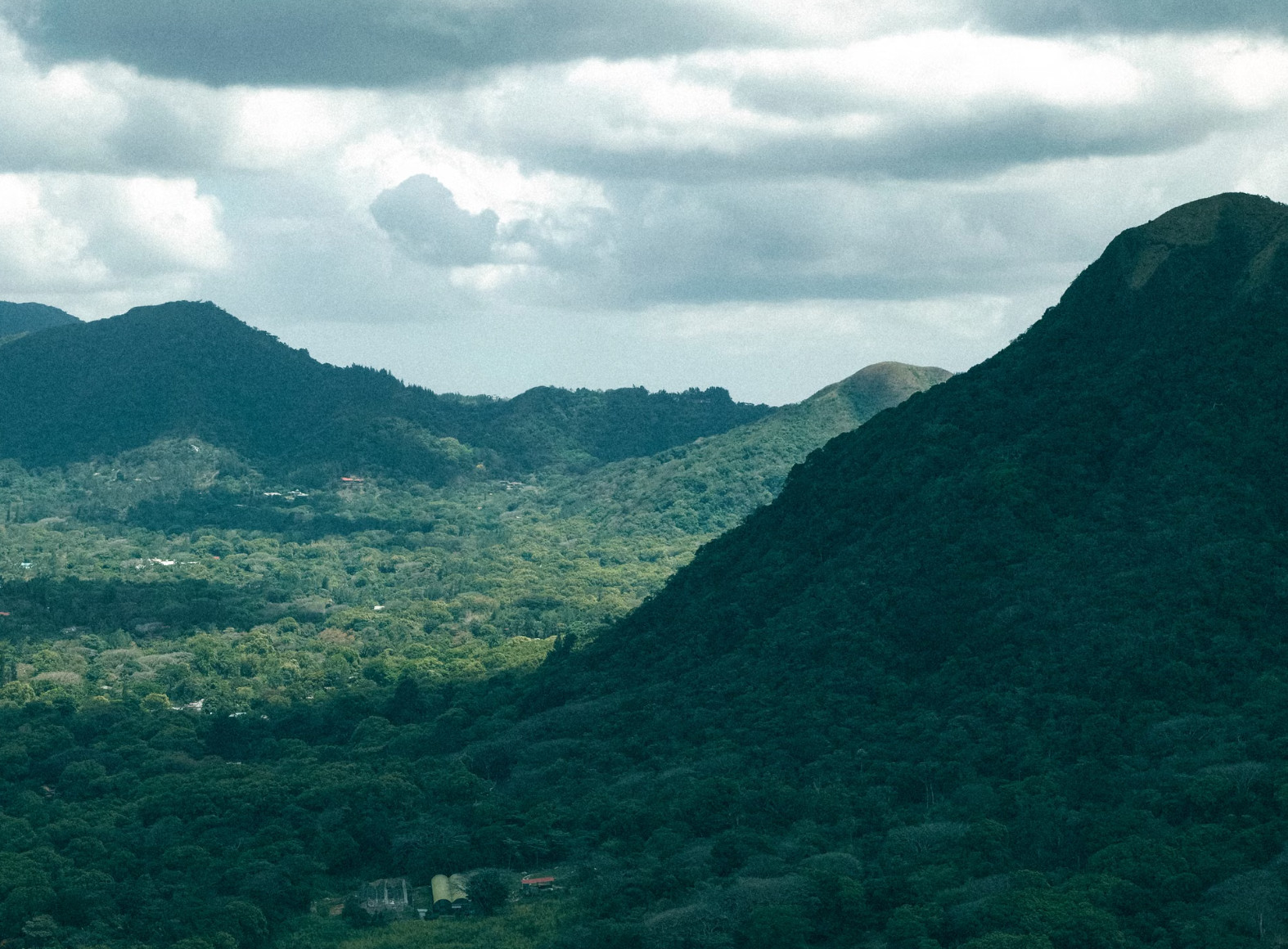 Forested green mountains and valley under cloudy sky, Panama