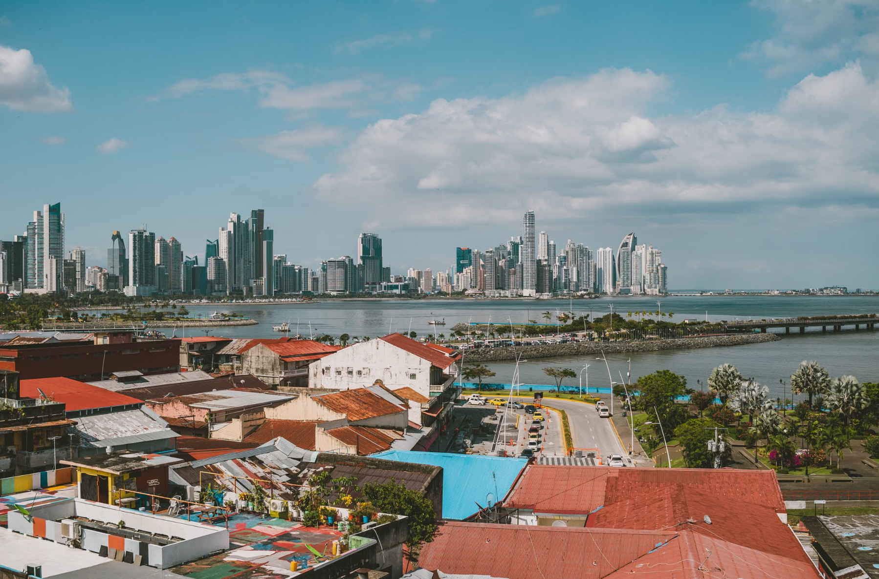 Panama City skyscrapers viewed across bay from old rooftops