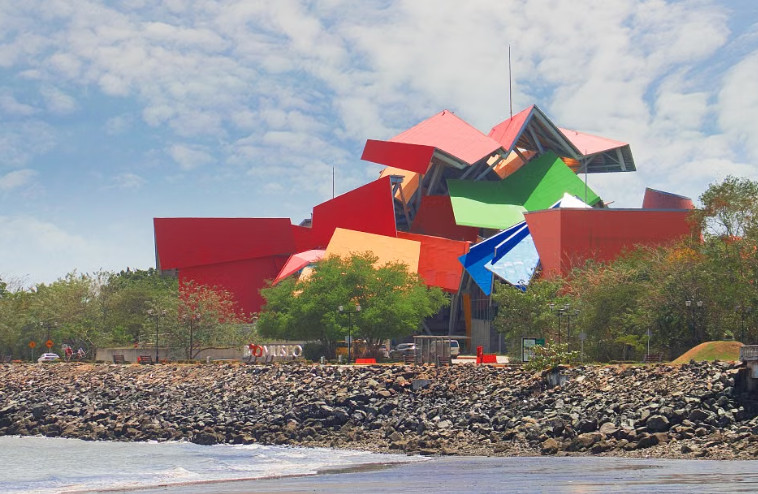 Frank Gehry's colourful angular Biomuseo building beside the shoreline