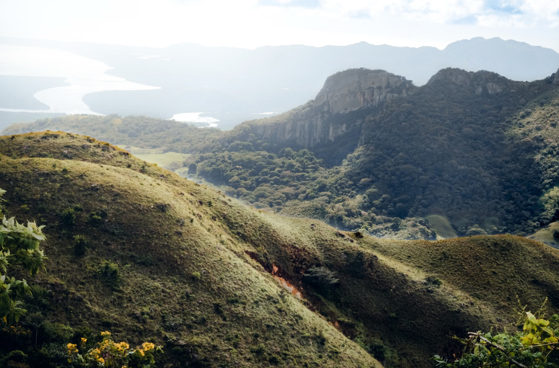 Rolling green hills, cliffs and lake in rural Panama
