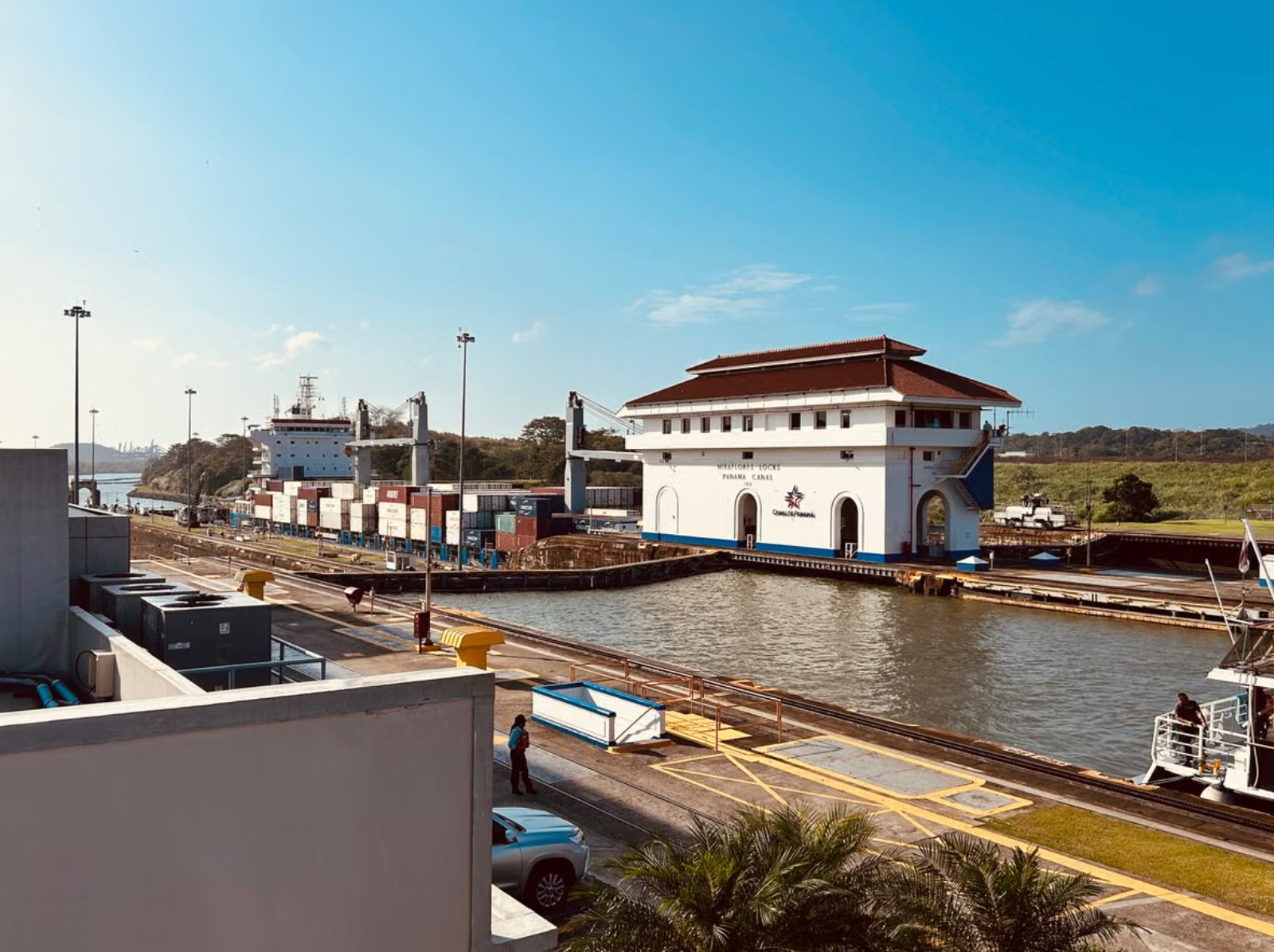 Cargo ship passing Miraflores Locks visitor center, Panama Canal