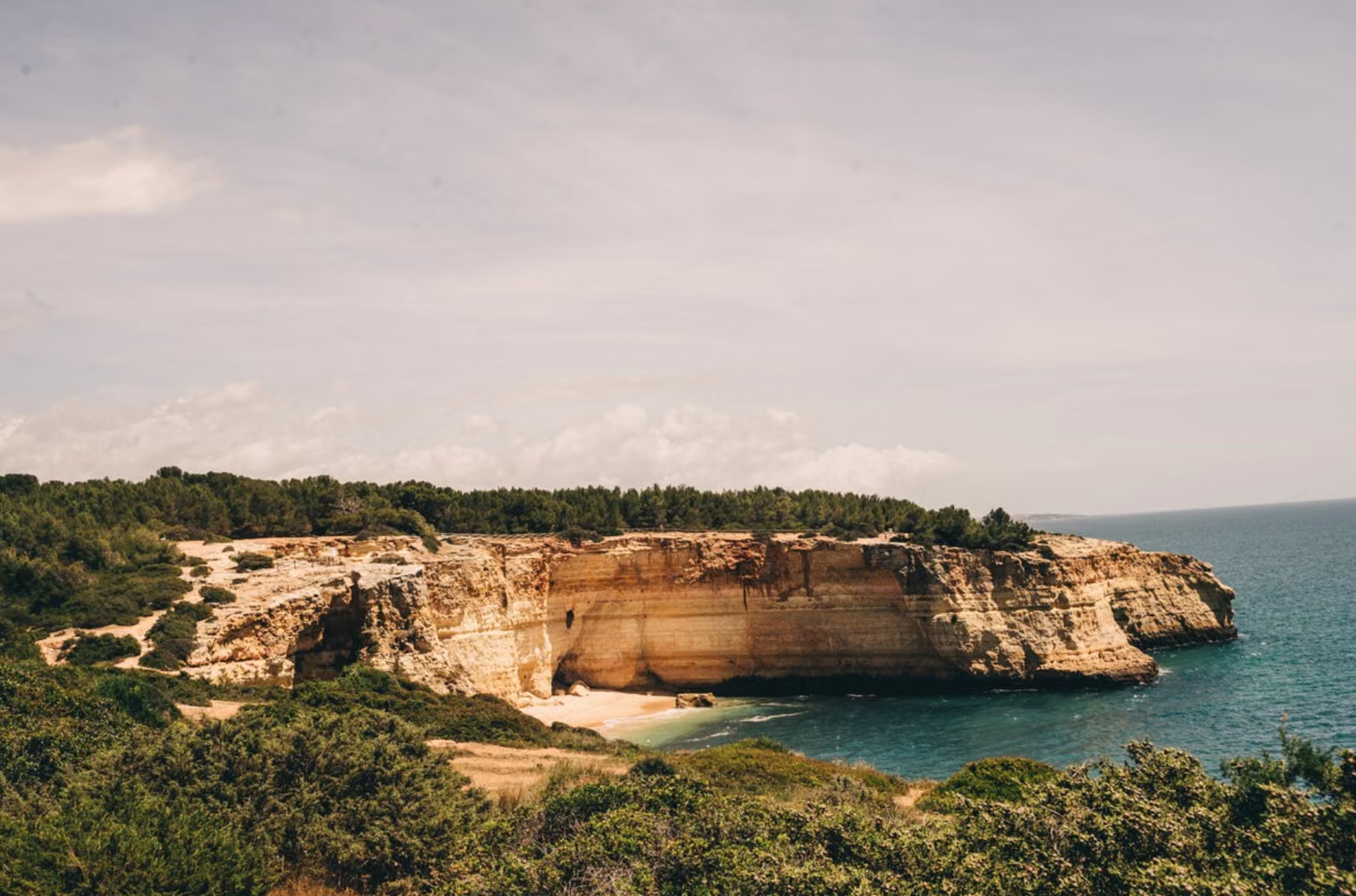 Cliff-backed cove beach near Benagil on the central Algarve coast