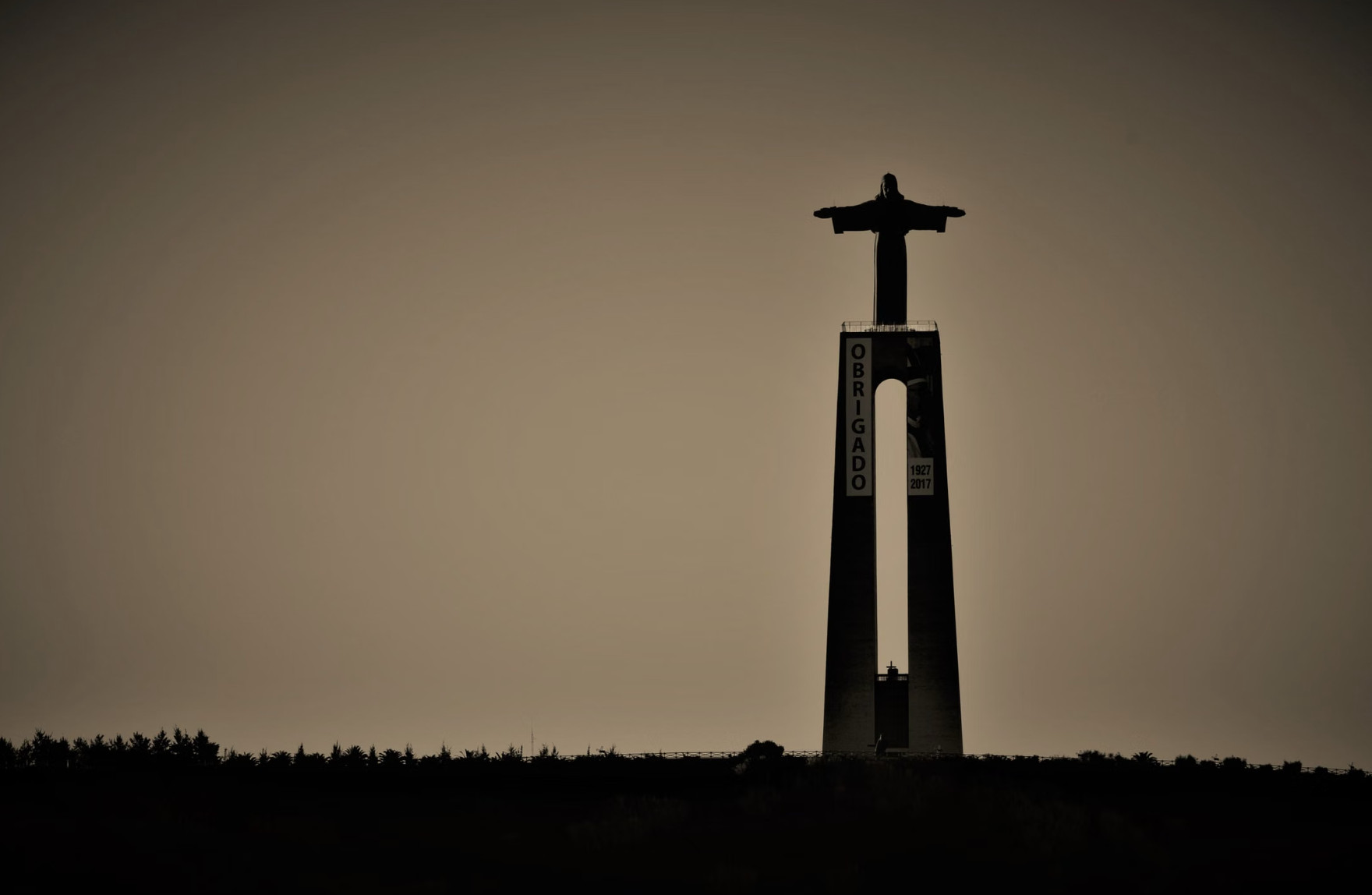 The white Cristo Rey statue overlooking Cali at sunset
