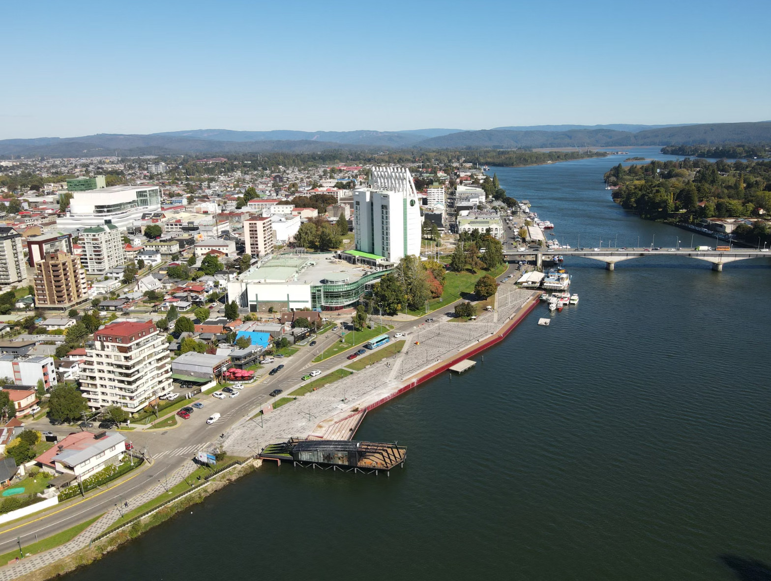 Aerial view of a riverside city with modern buildings