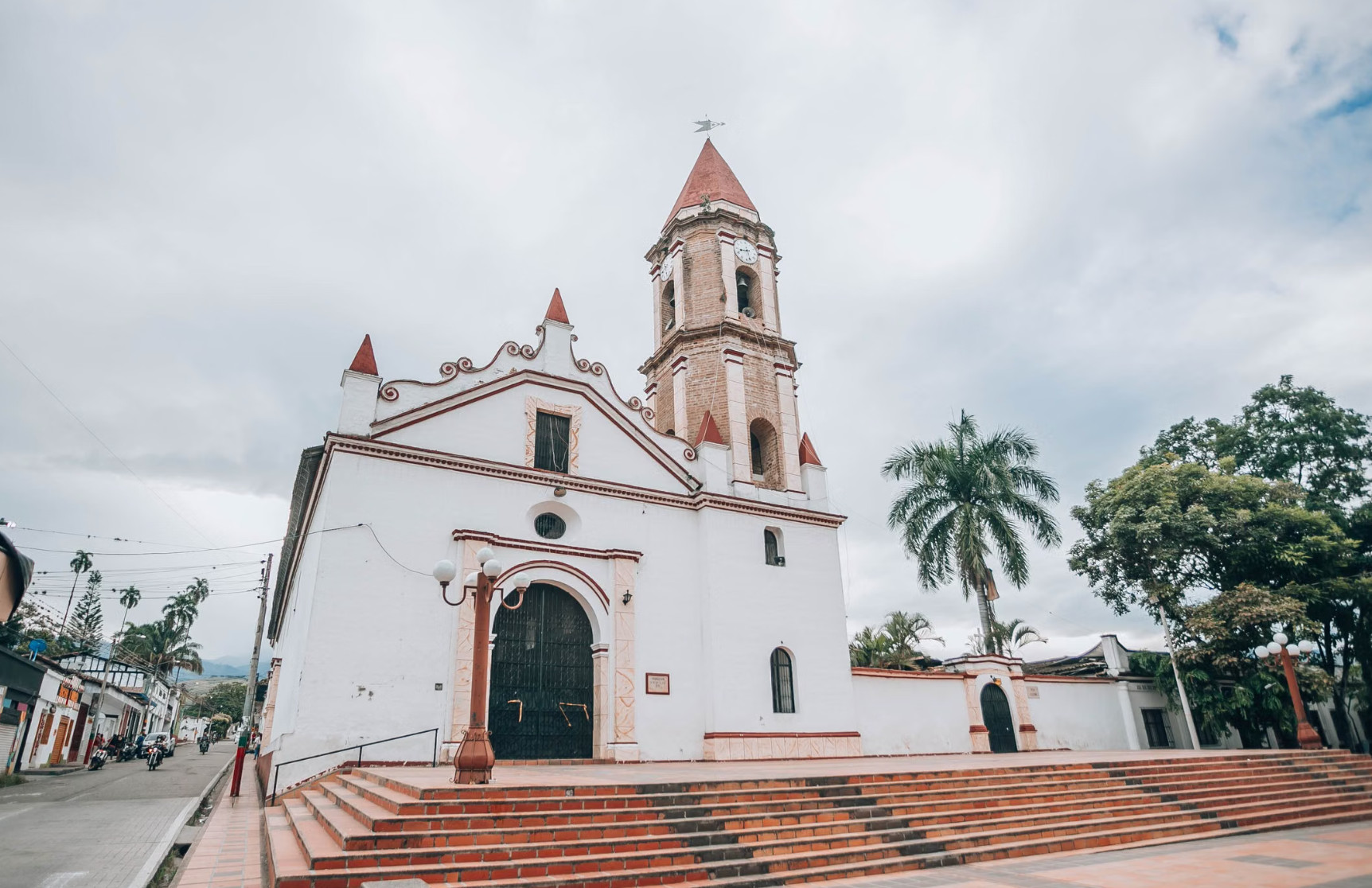 White colonial church with clock tower in Colombian town