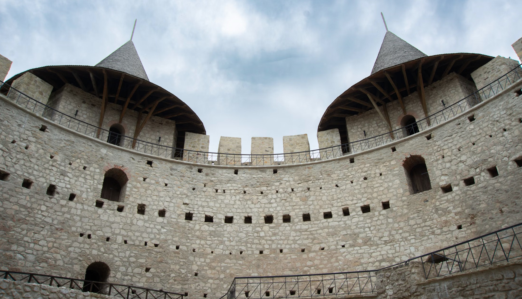 Interior stone walls and towers of medieval circular fortress