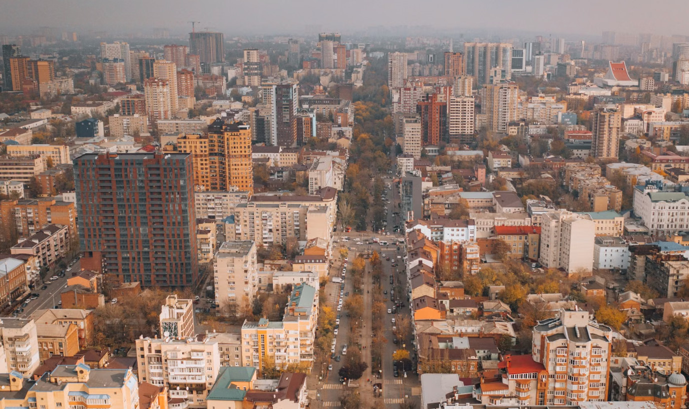 Aerial view of dense European city in autumn light