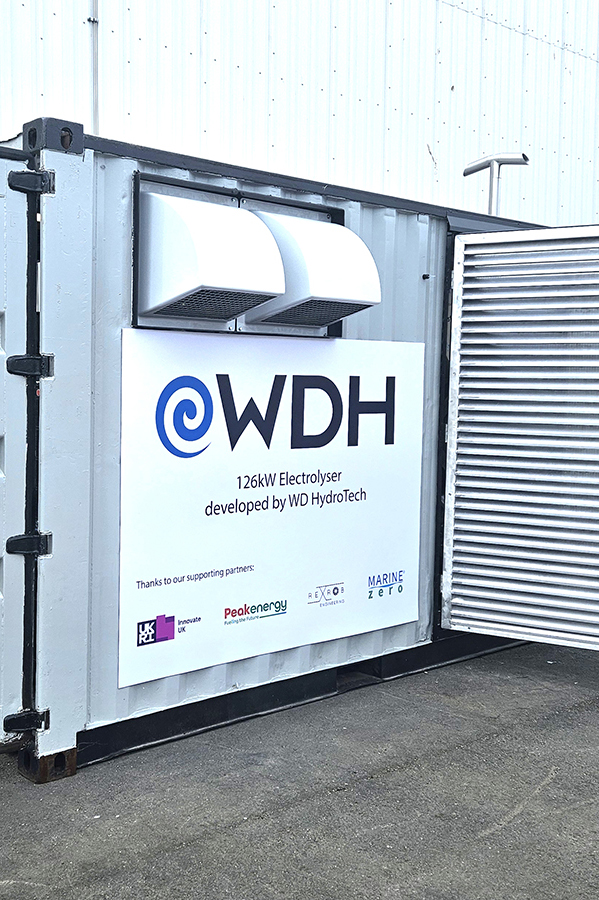 Container exterior with WD HydroTech 126kW electrolyser sign and partner logos on it.