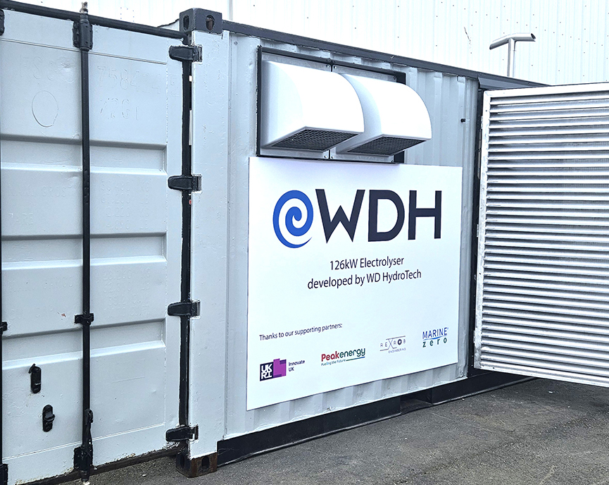 Container exterior with WD HydroTech 126kW electrolyser sign and partner logos on it.