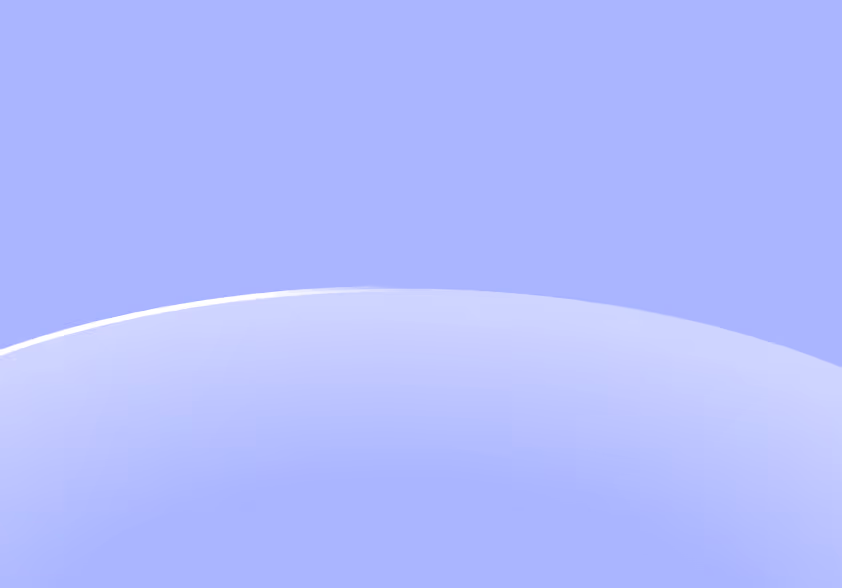 Close-up of a translucent curved surface with a smooth glossy finish against a soft blue background.