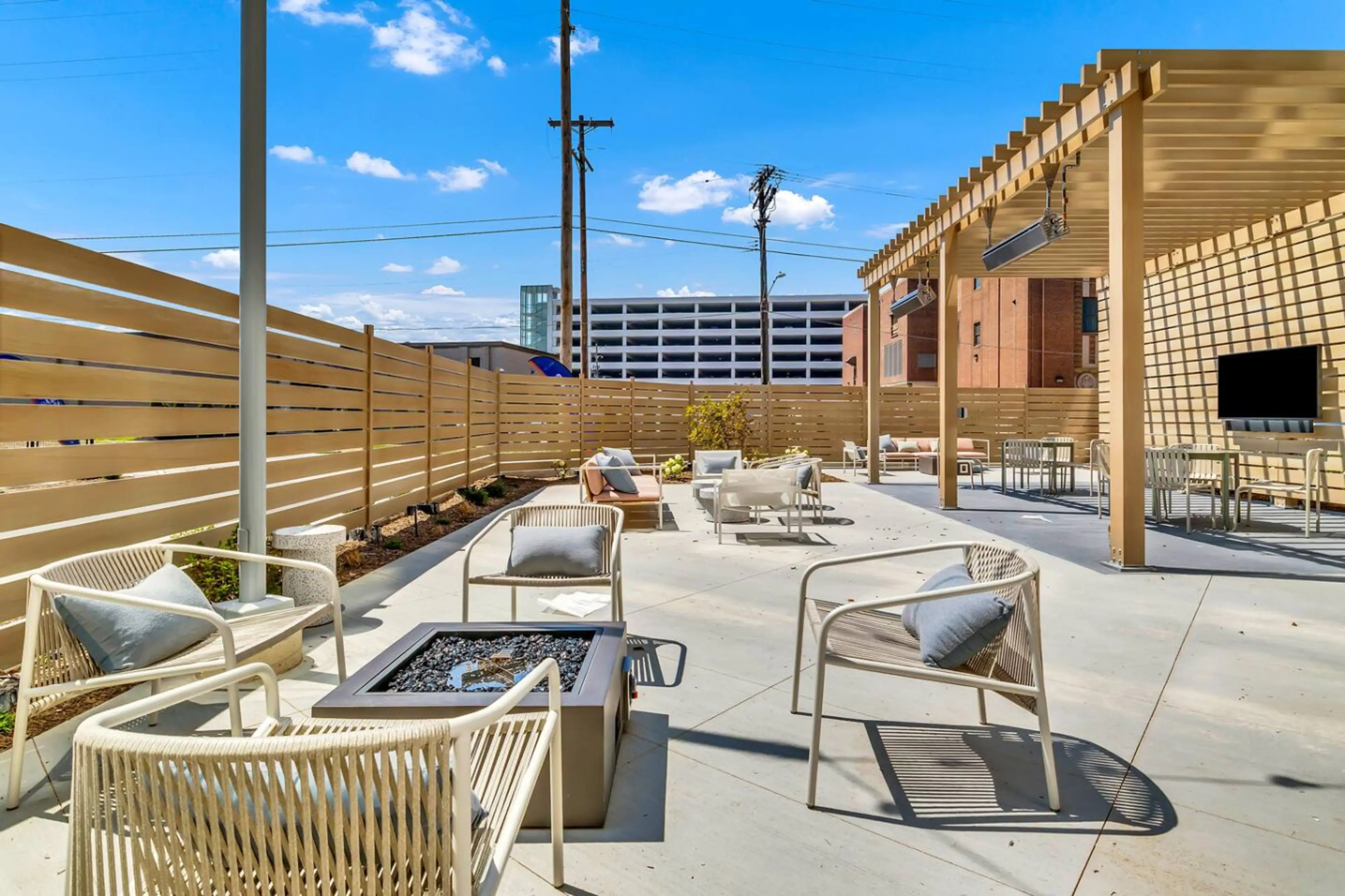 Two built-in gas grills on an outdoor counter with downtown Cleveland behind