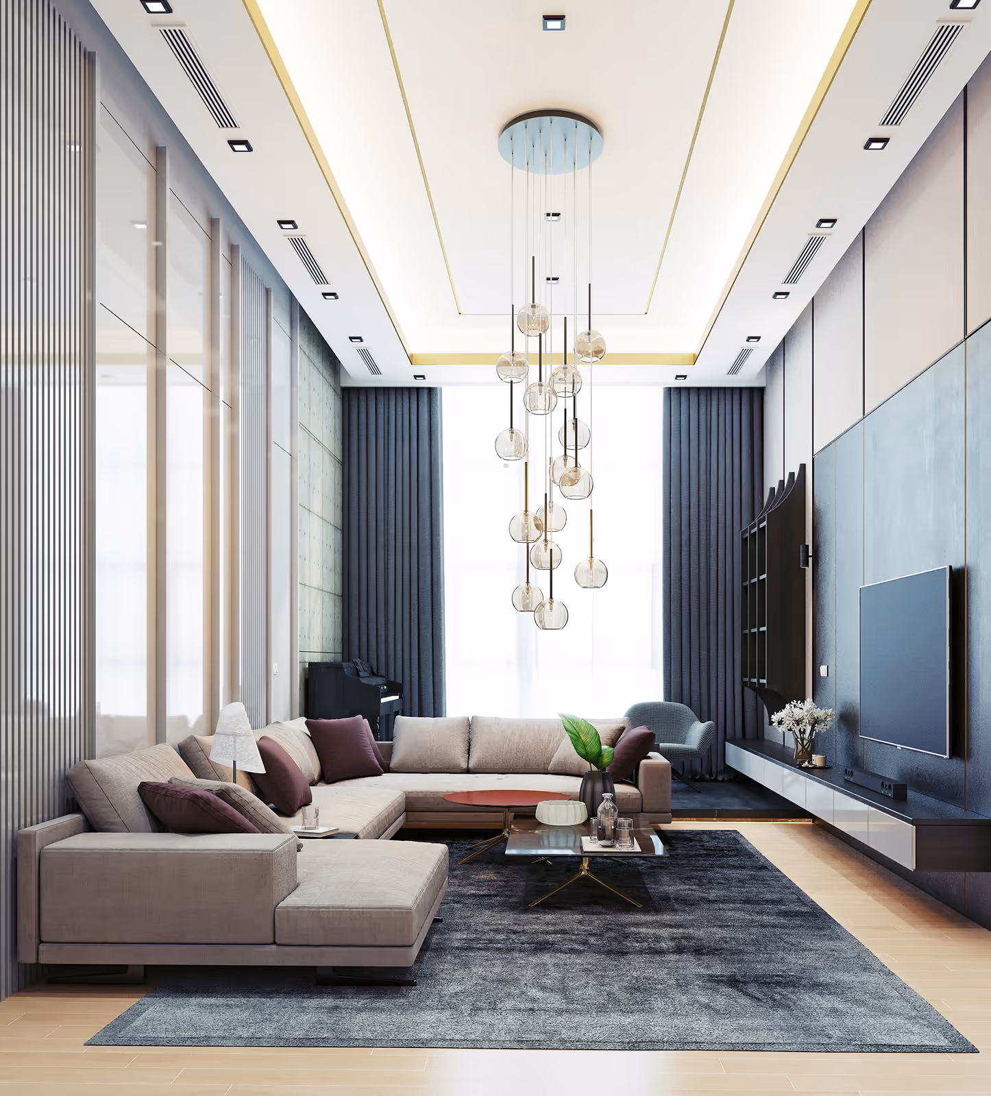 A finish modern living room with large beige sectional sofa, glass tables, dark rug, and hanging pendant lights at AZ Builders LLC