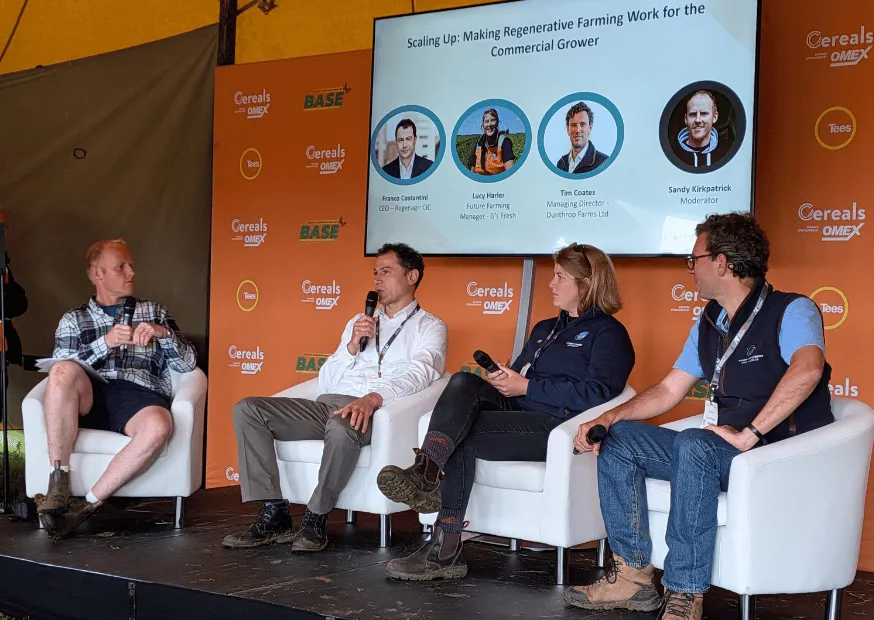 Four panellists on stage at Cereals beneath a screen reading Scaling Up: Making Regenerative Farming Work for the Commercial Grower
