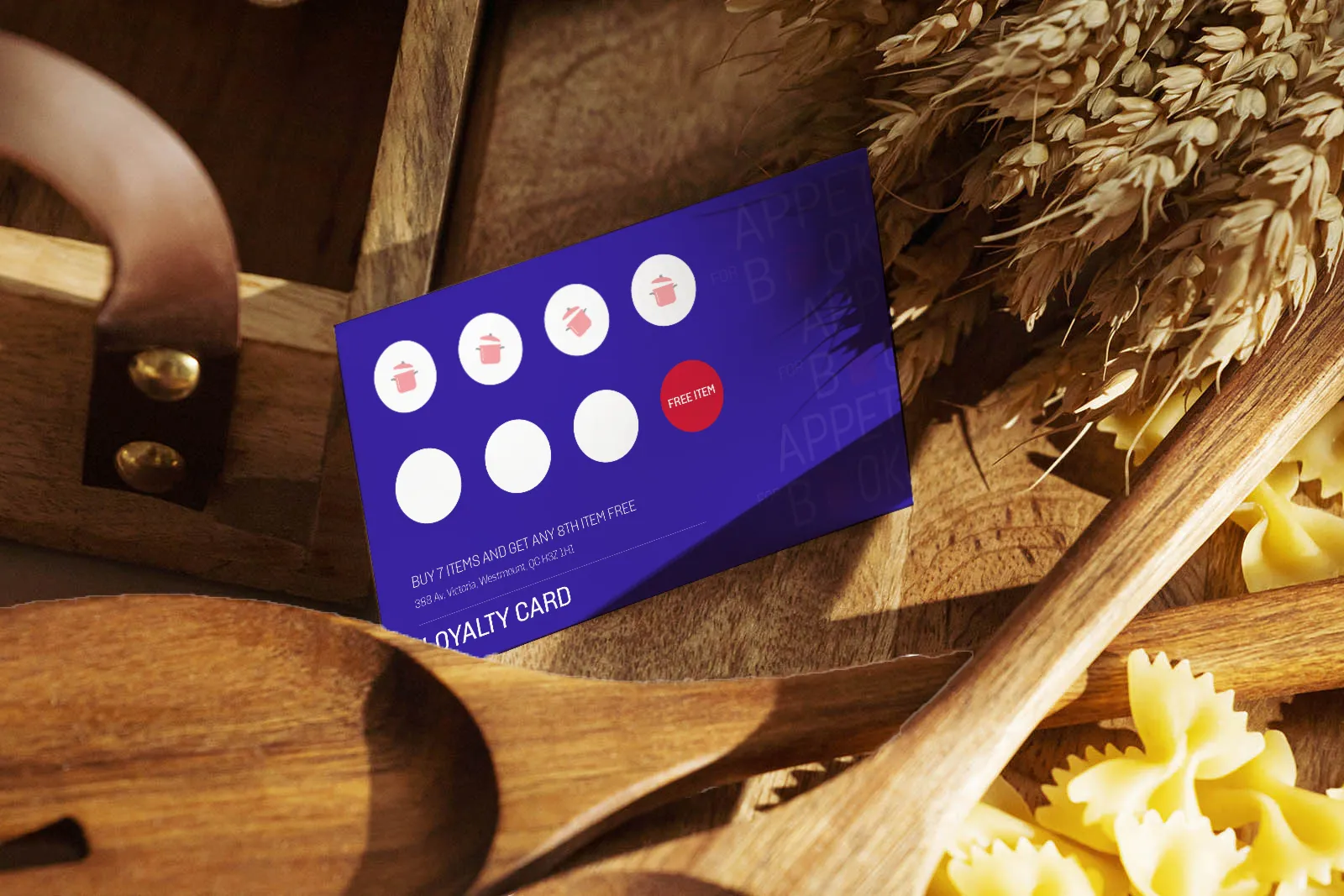 Purple loyalty card on wooden surface with kitchen utensils, showing 4 stamped items and free item stamp.