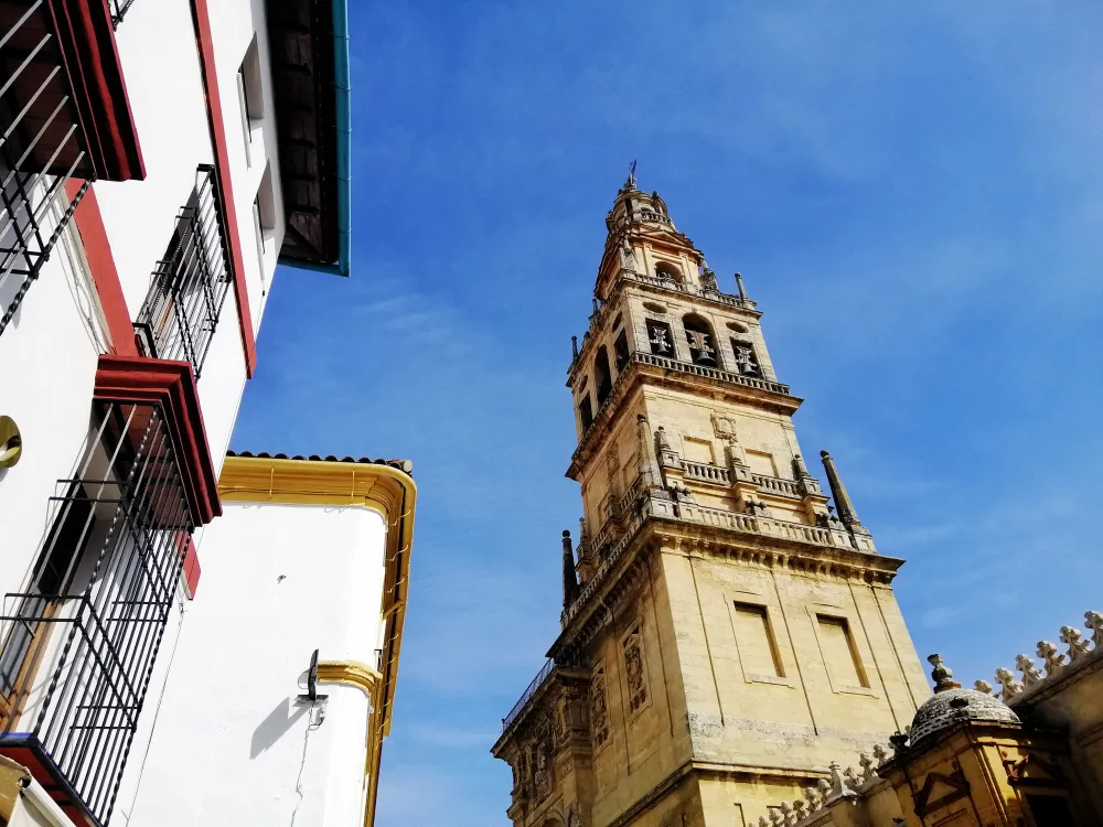 Bell tower of Córdoba's Mezquita-Catedral against a blue sky