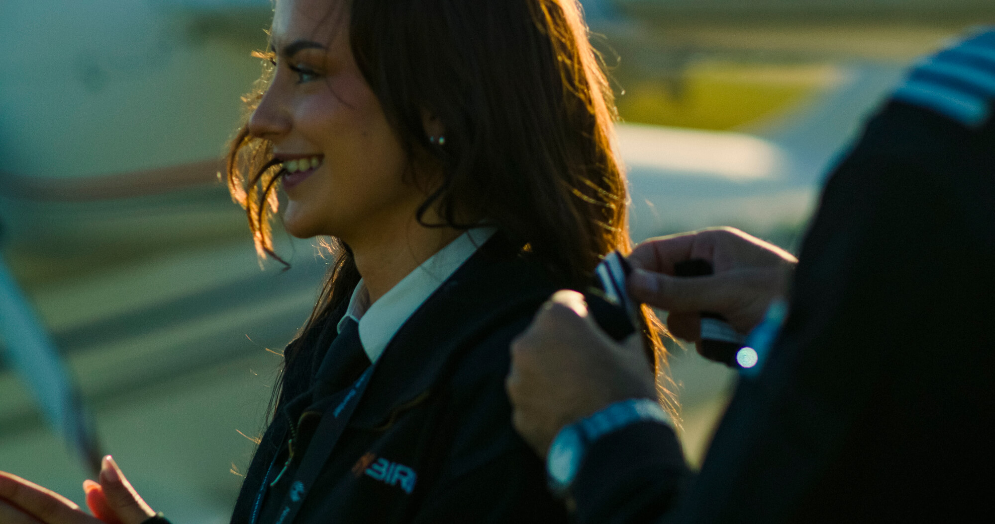 Newly graduated Greybird pilot having her wings pinned on