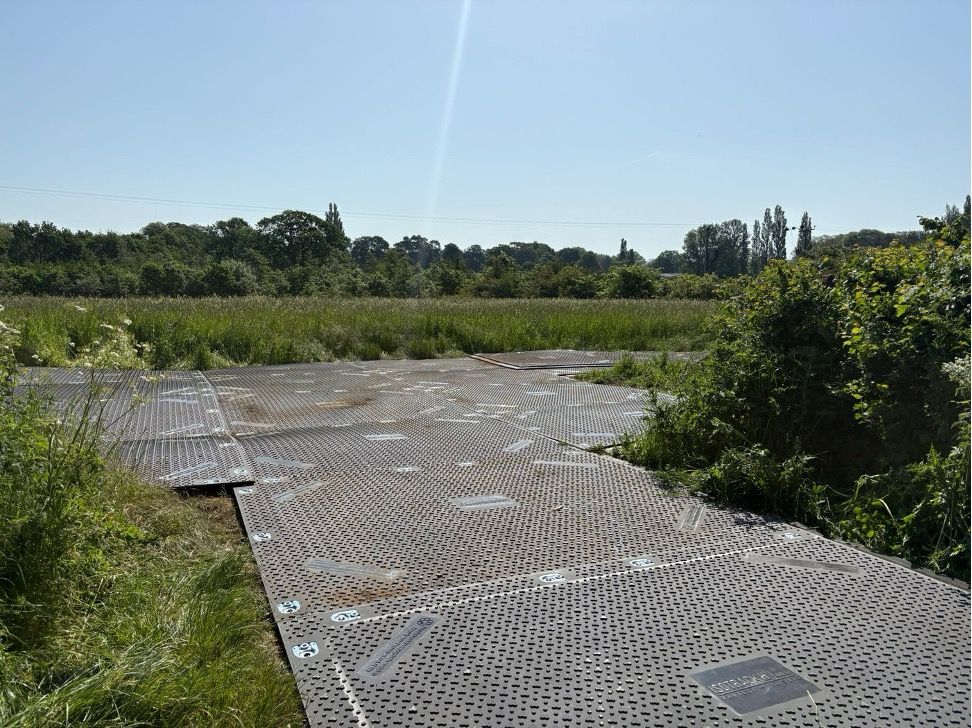 Trackway installation on soft grassland
