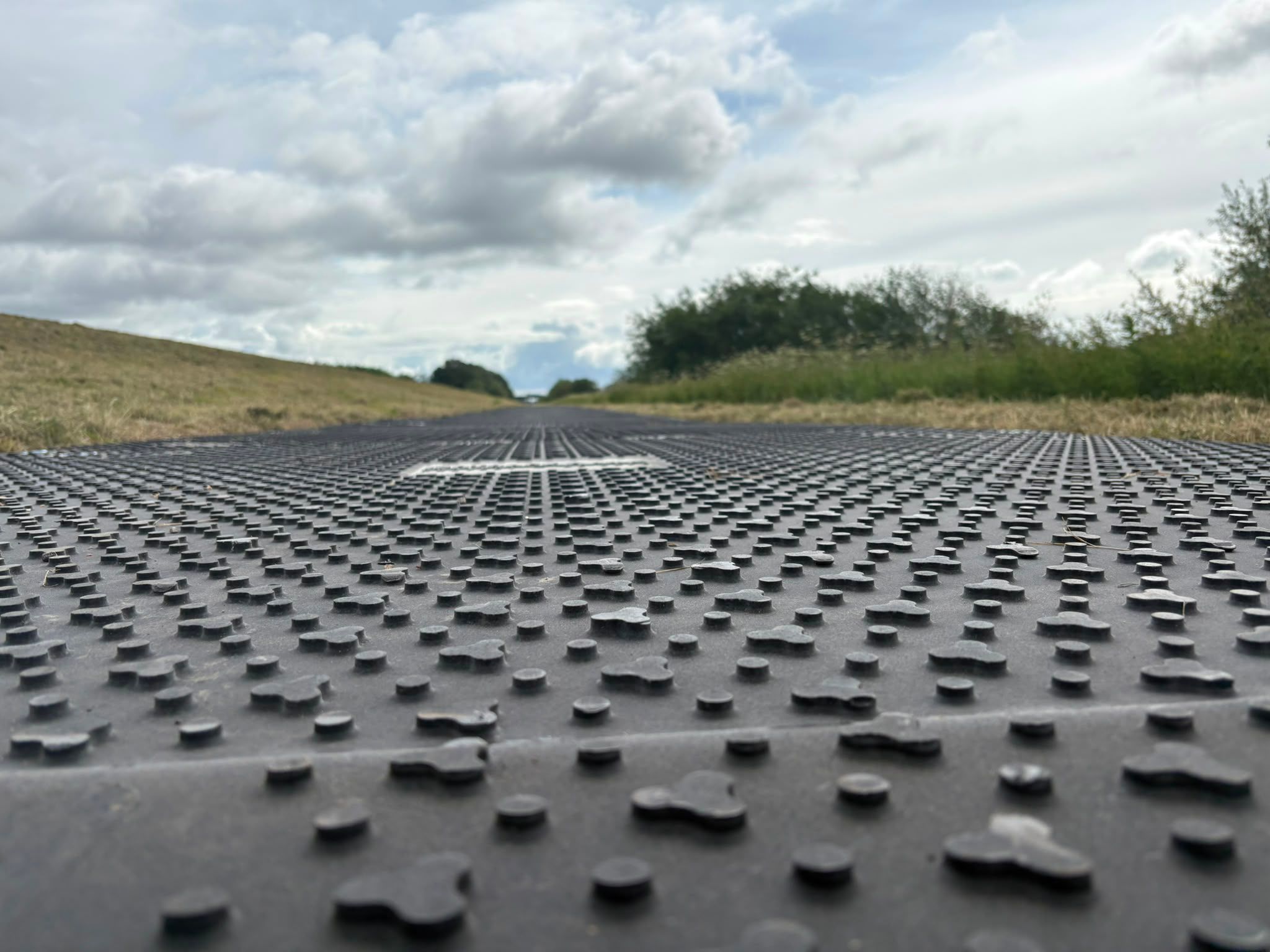Temporary trackway installed across the project corridor to provide stable access over soft ground conditions.