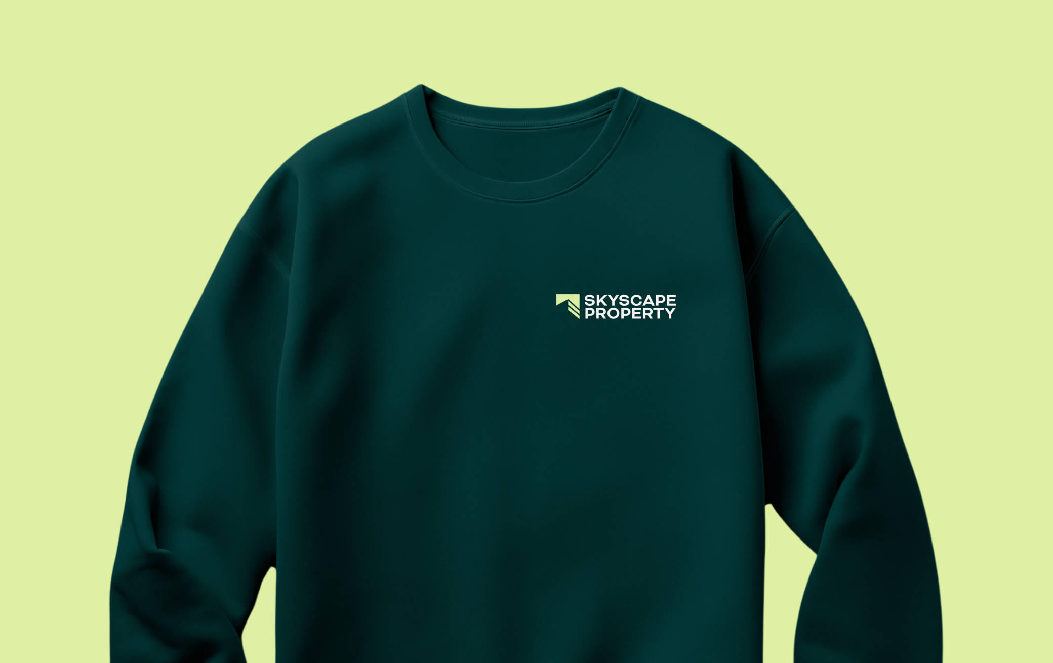 Branded merchandise mockups demonstrating how the Skyscape Property identity adapts across clothing and promotional items.