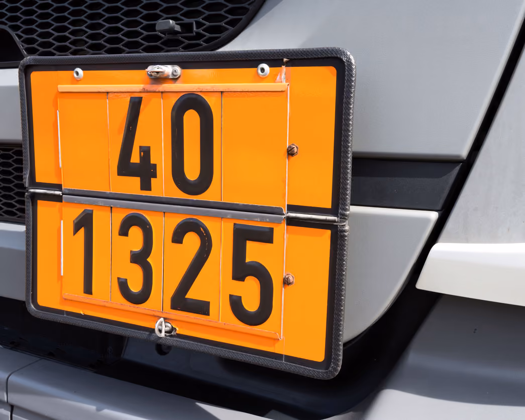 Orange hazard plate on vehicle showing numbers 40 and 1325 in black on two rows.