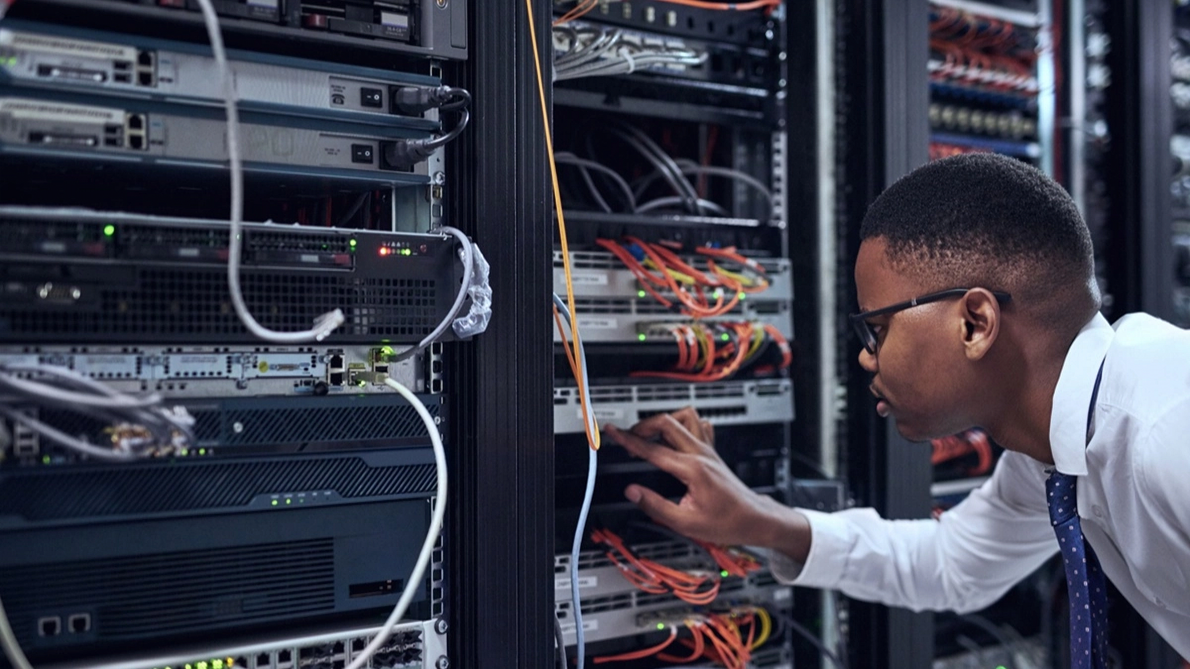 Image showing a technician inspecting a structured cabling installation