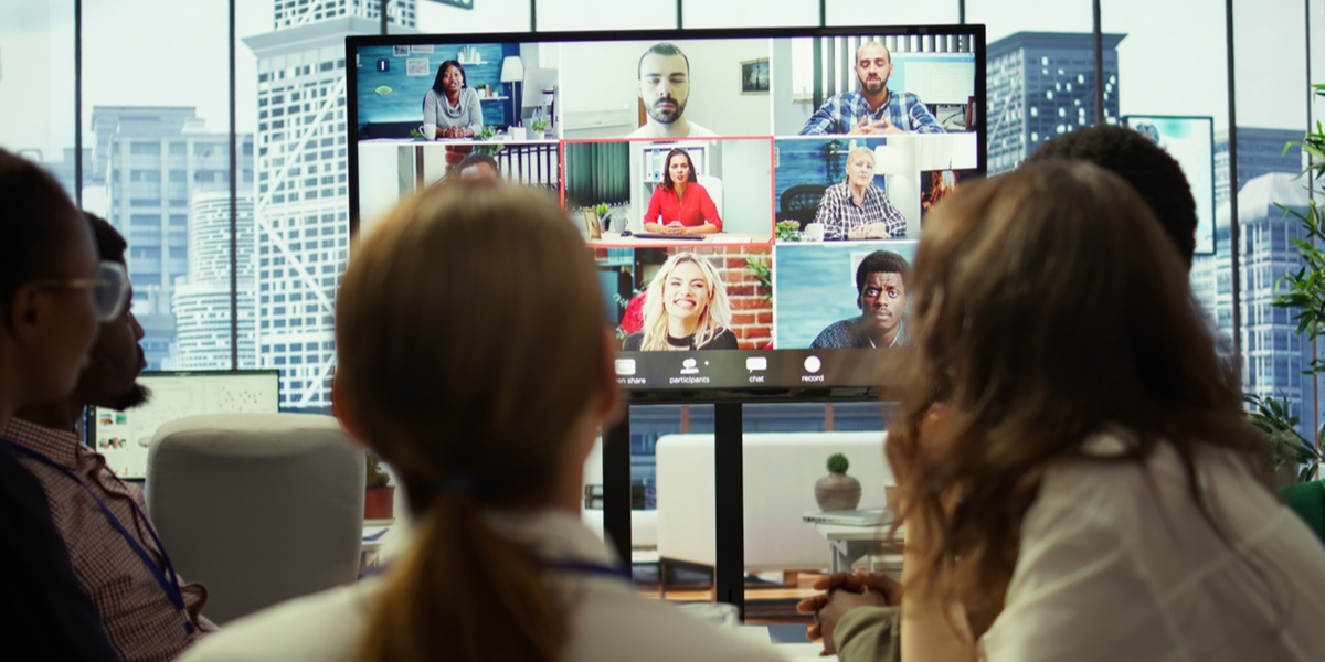 Image showing a work team using audio visual (AV) systems to attend a virtual meeting