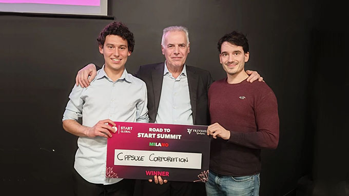 Capsule Team holding the Road to Start Summit award