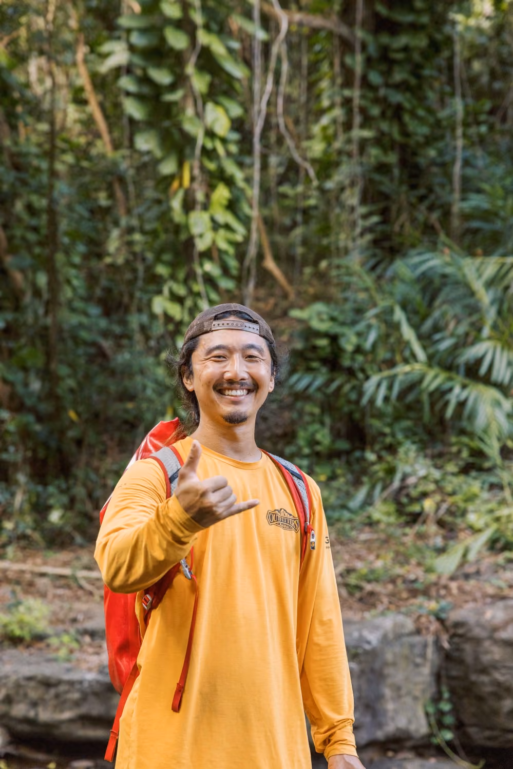 Outfitters Kauai guide hiking to Hidden Falls on a Kauai kayak and waterfall adventure tour in Lihue