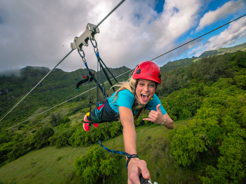 Guest ziplining on Hawaii's longest zipline the FlyLine with Outfitters Kauai