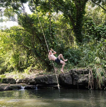 Rope swing over Pirate Pool at Kīpū Ranch, a Pirates of the Caribbean filming location