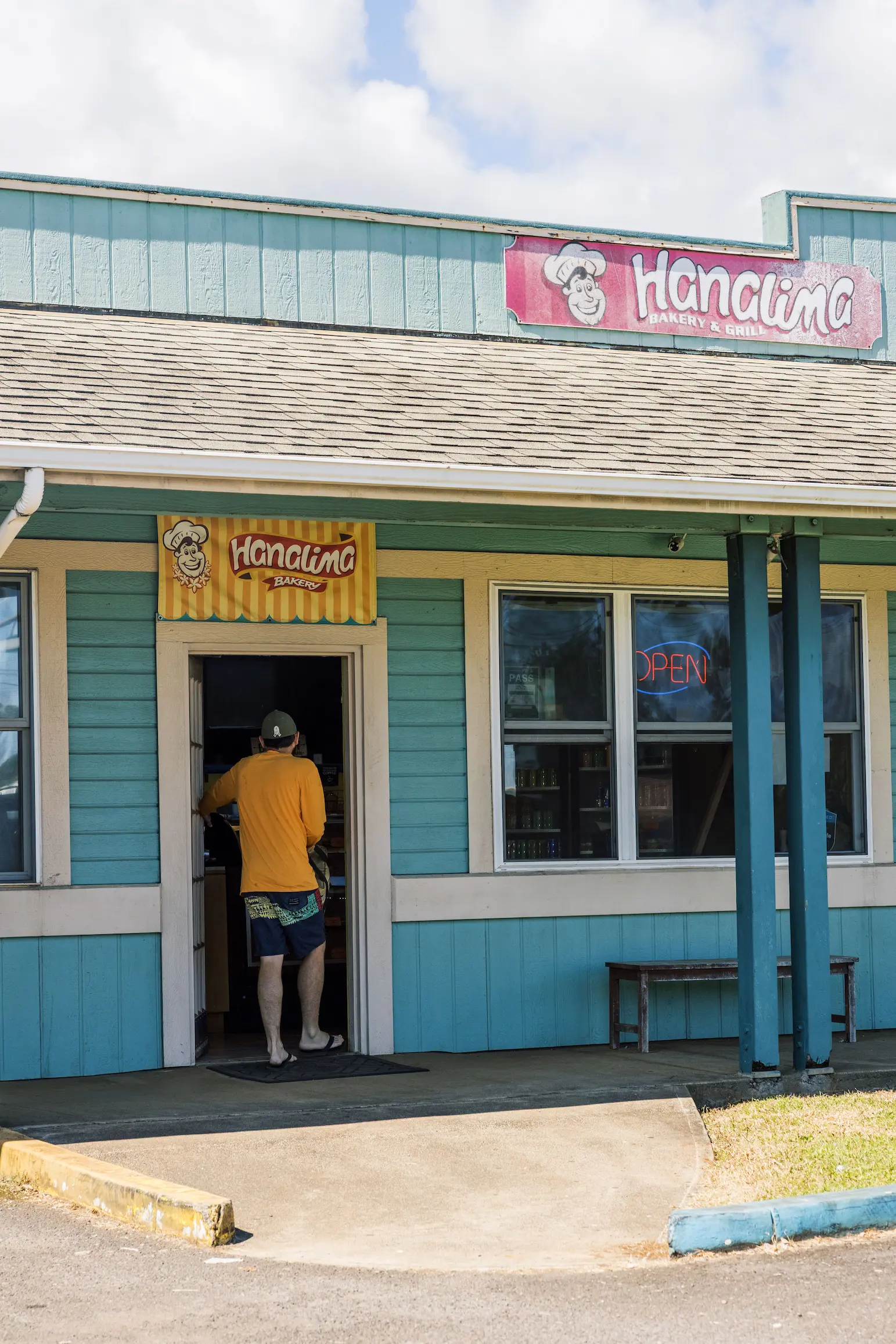 Outfitters Kauai staff member walking into a building
