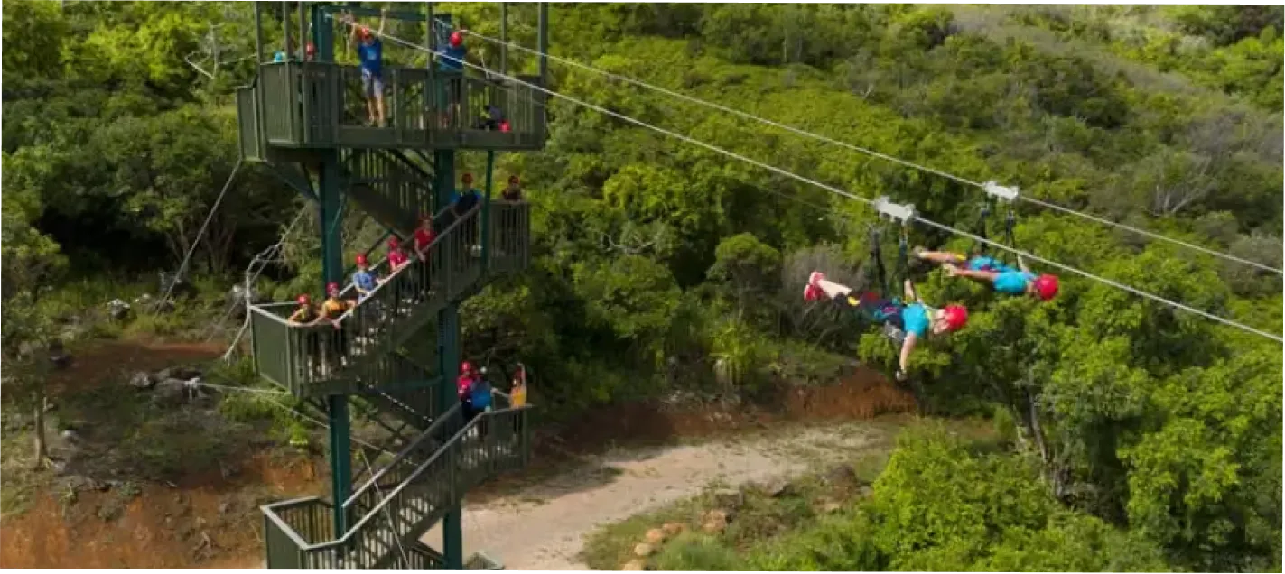 Aerial view of the FlyLine launch tower with guests on the platform and riders launching