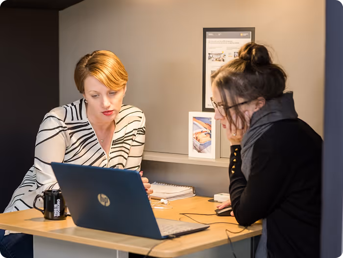 two students consulting with each other