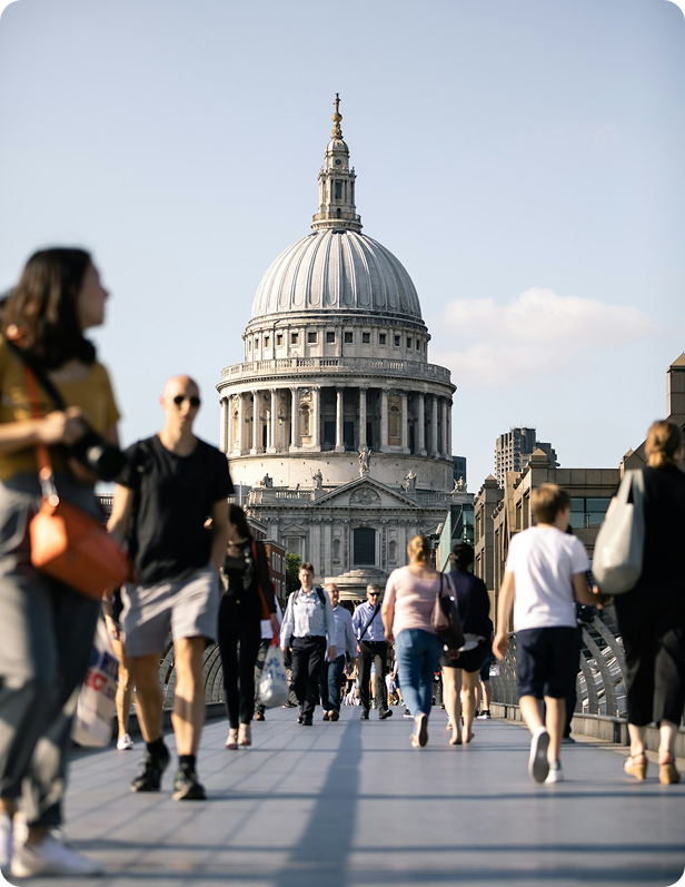 People walking in front of UK's historic building