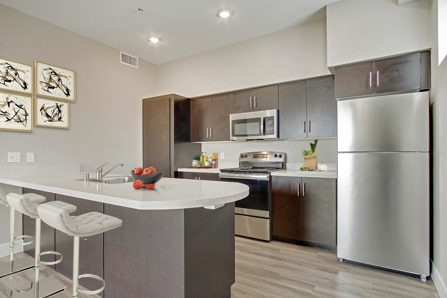 Kitchen with breakfast bar and stainless steel appliances rendering 
