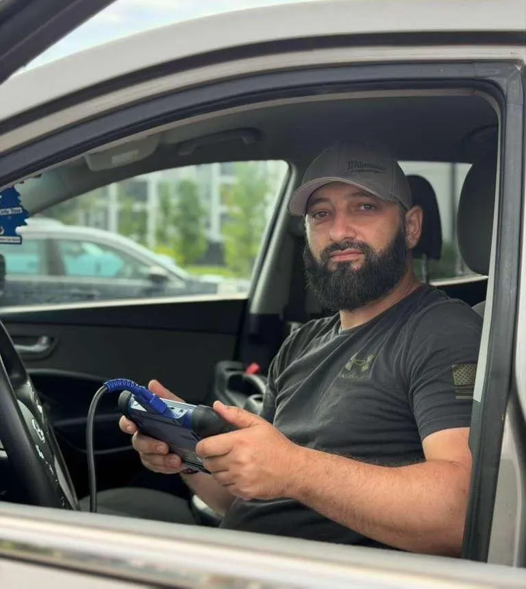locksmith technician in a car
