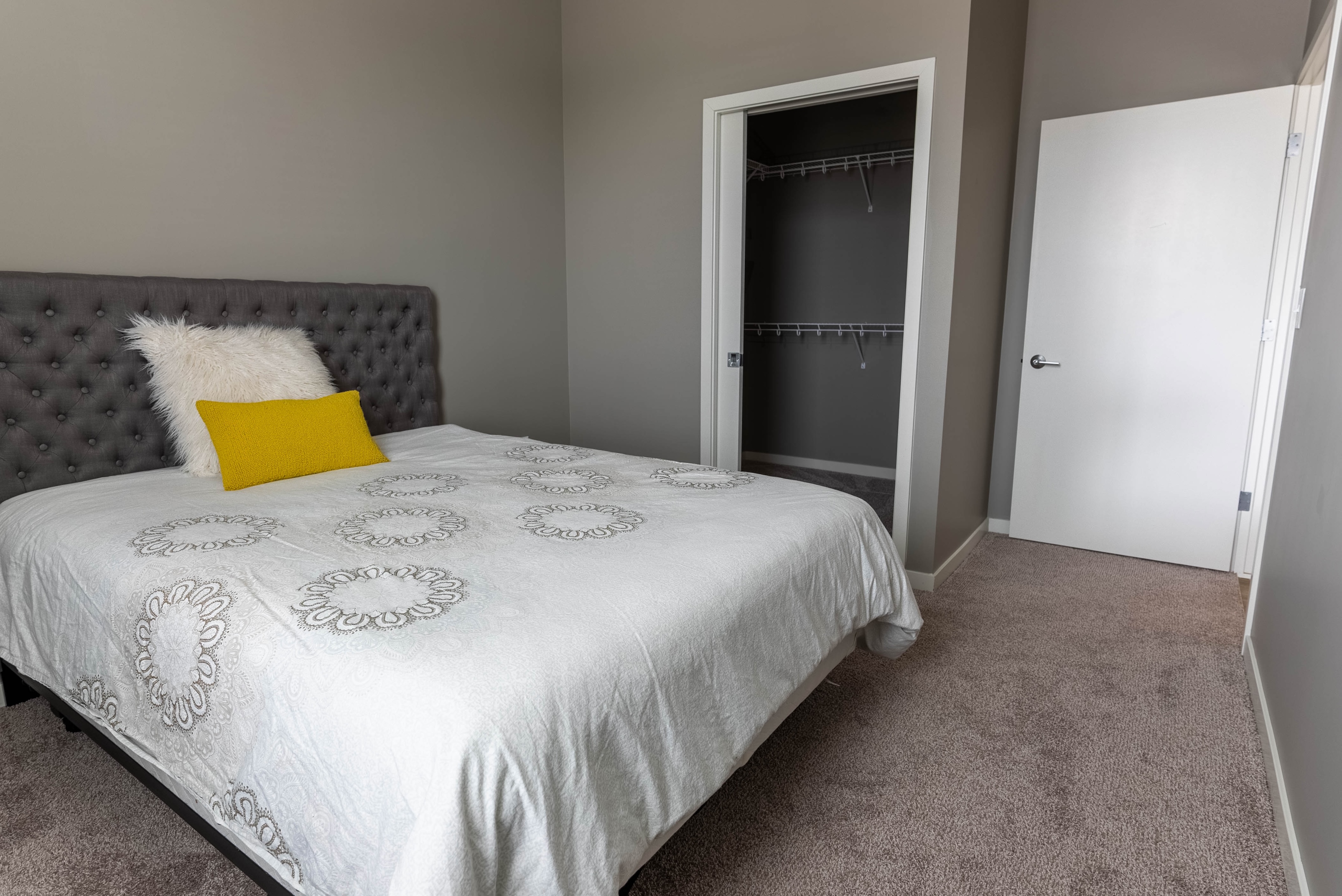 Bedroom with large bed and closet