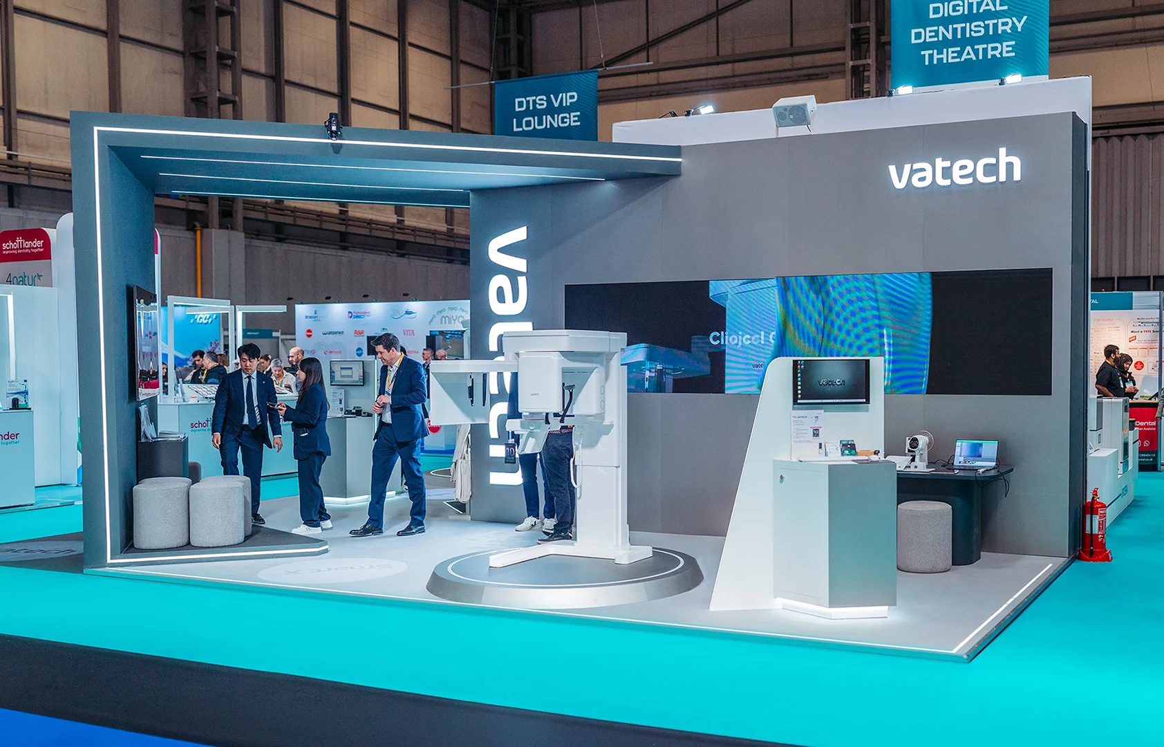Vatech stand with large scale mahinery, LED features and overarching structures
