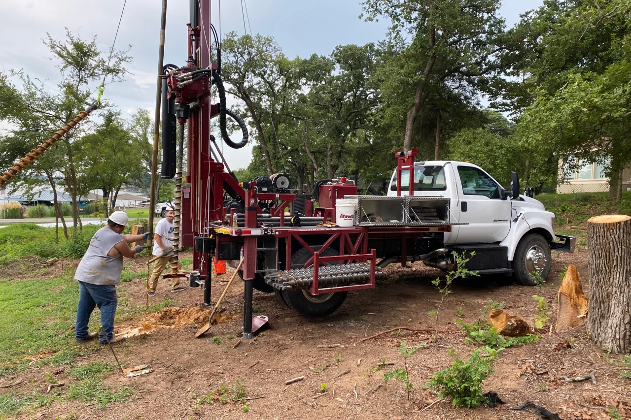 Geotechnical ground reinforcement project with heavy equipment and soil treatment systems