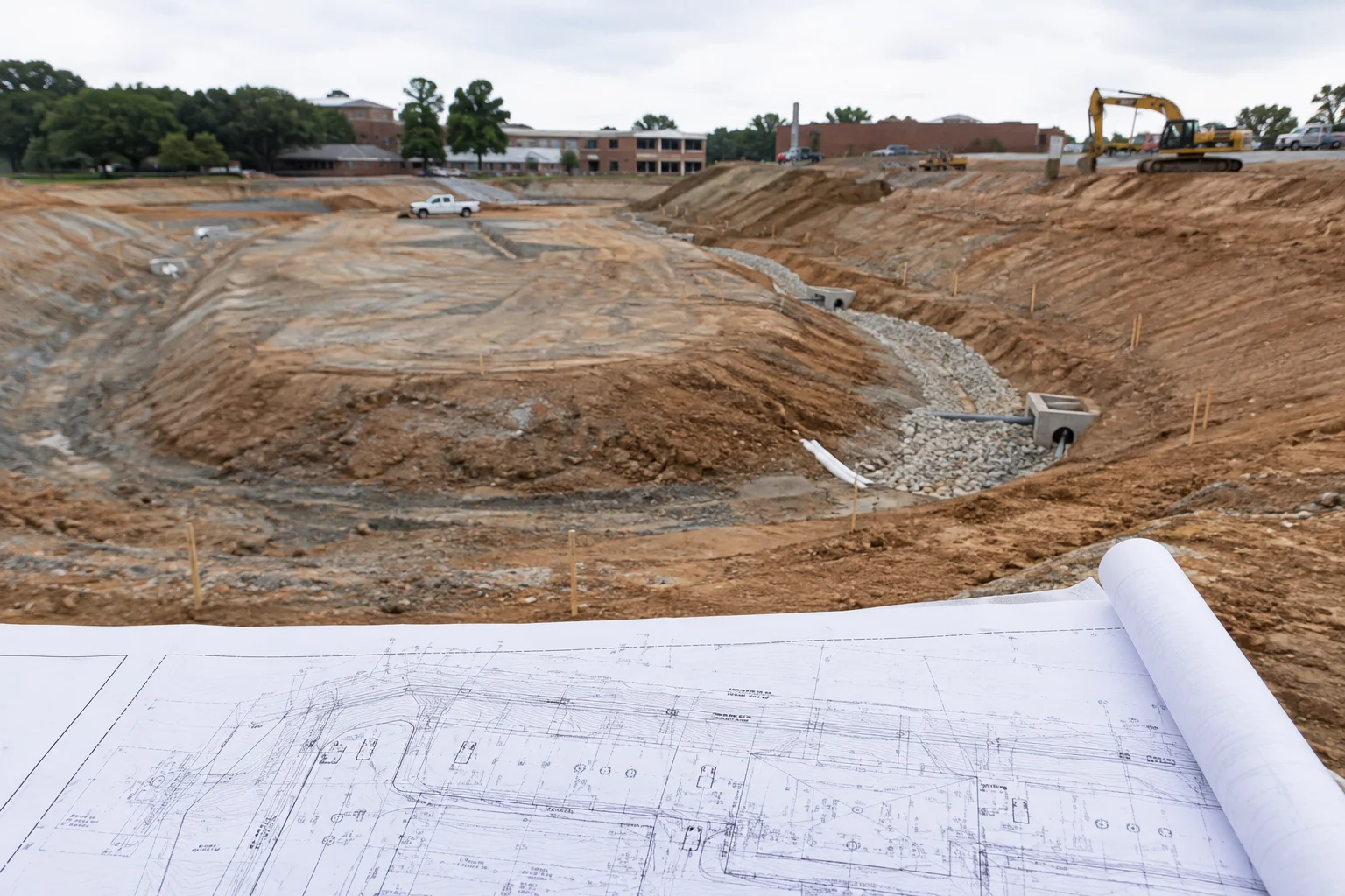 Geotechnical site exploration featuring soil core samples and subsurface testing equipment.