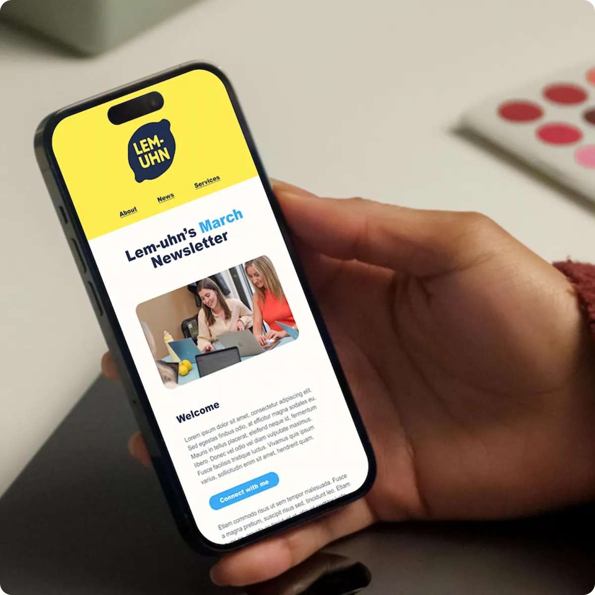 Hand holding phone displaying Lem-uhn March newsletter with menu, photo, welcome text, and button.